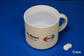 A donated drinking cup for use in medicine administration